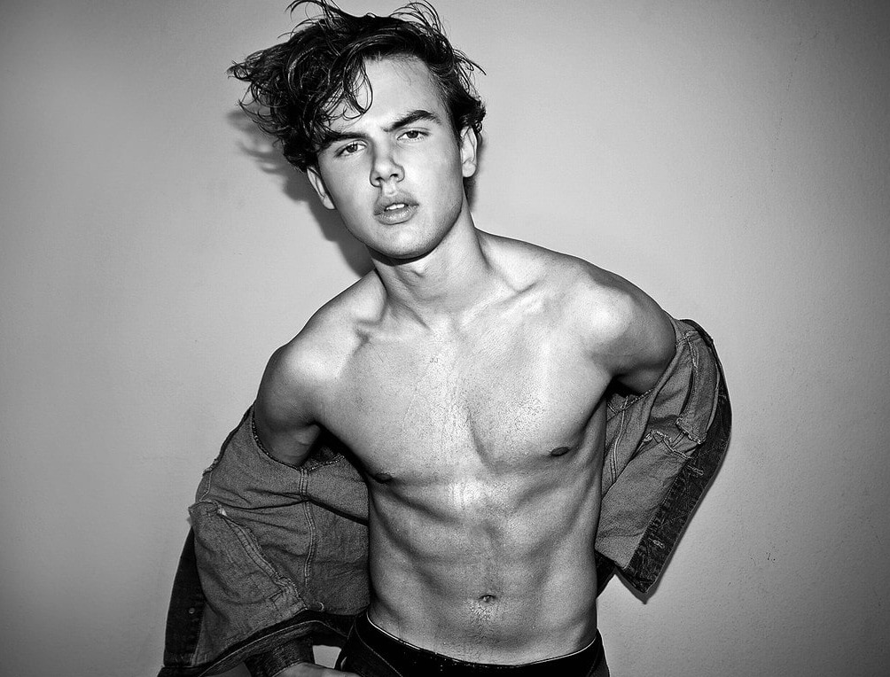 Garrett Wareing  posing showing six packs